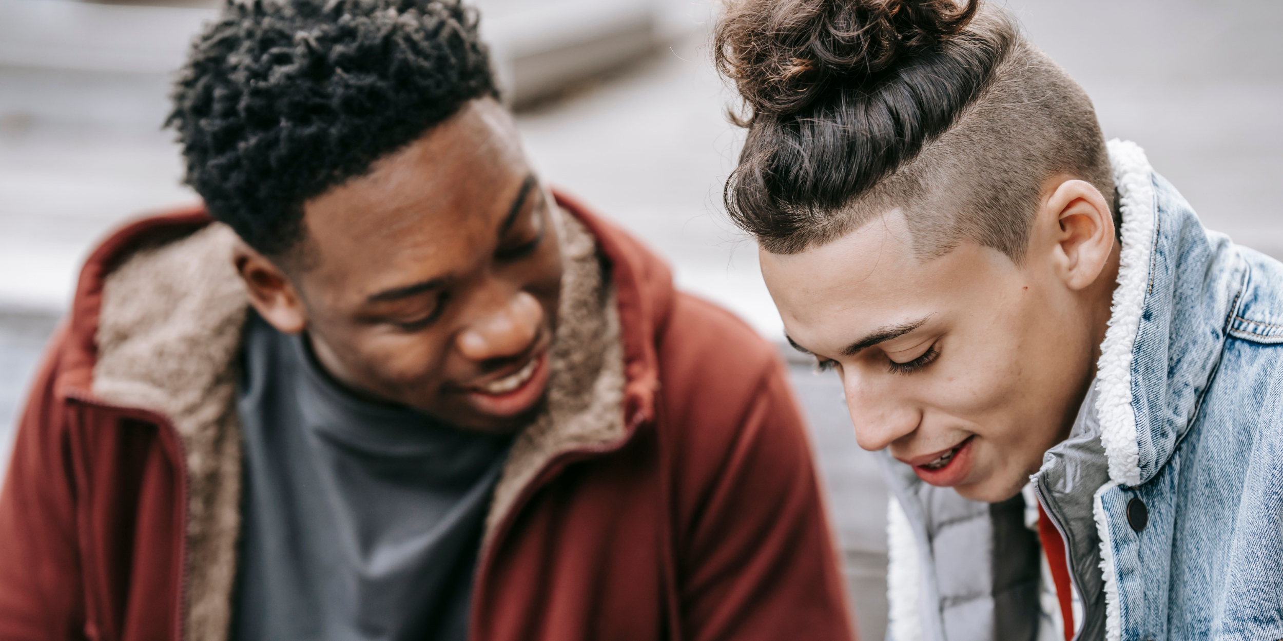 Two young men talking.