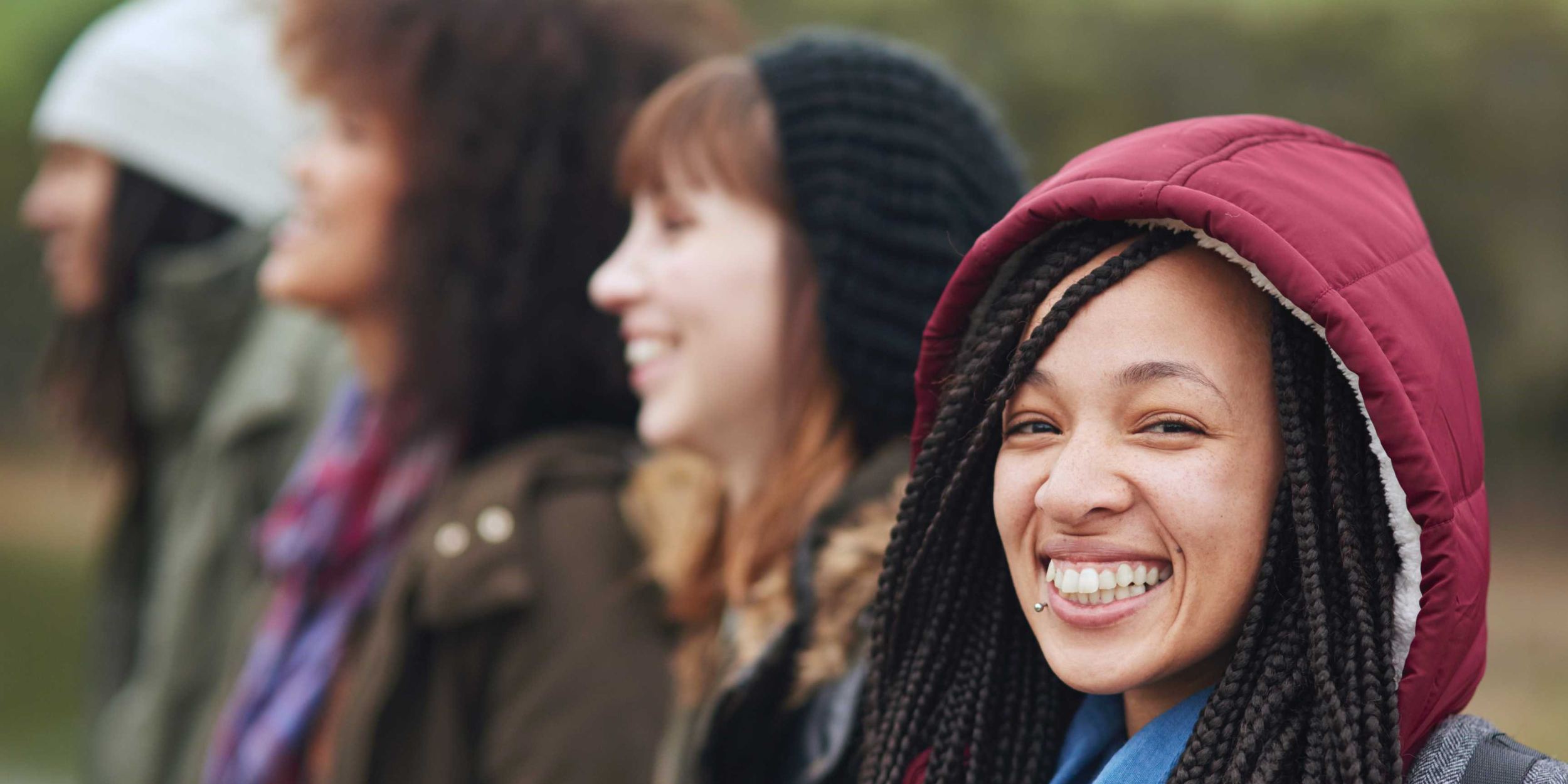 A group of young women smiling.
