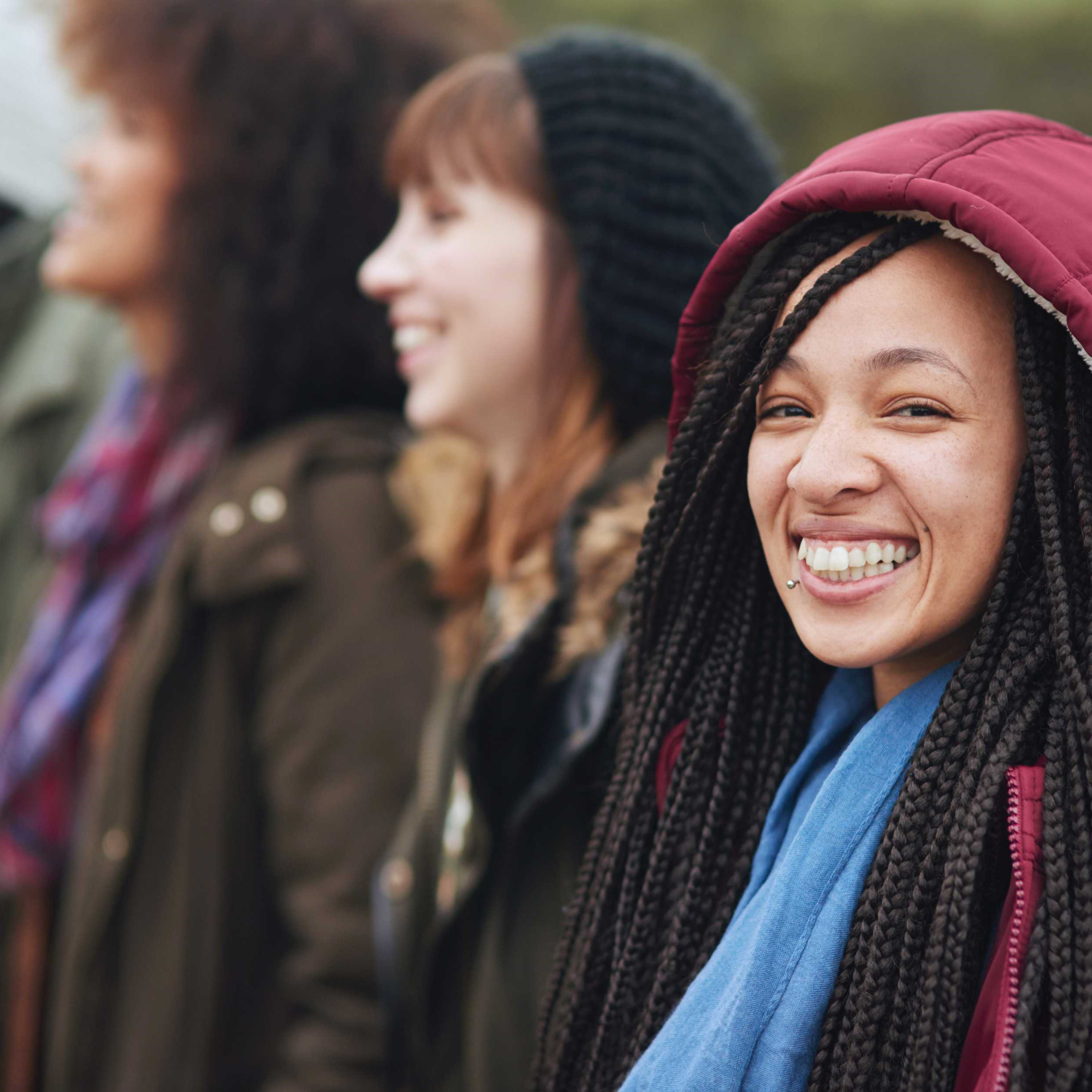 A group of young women smiling.