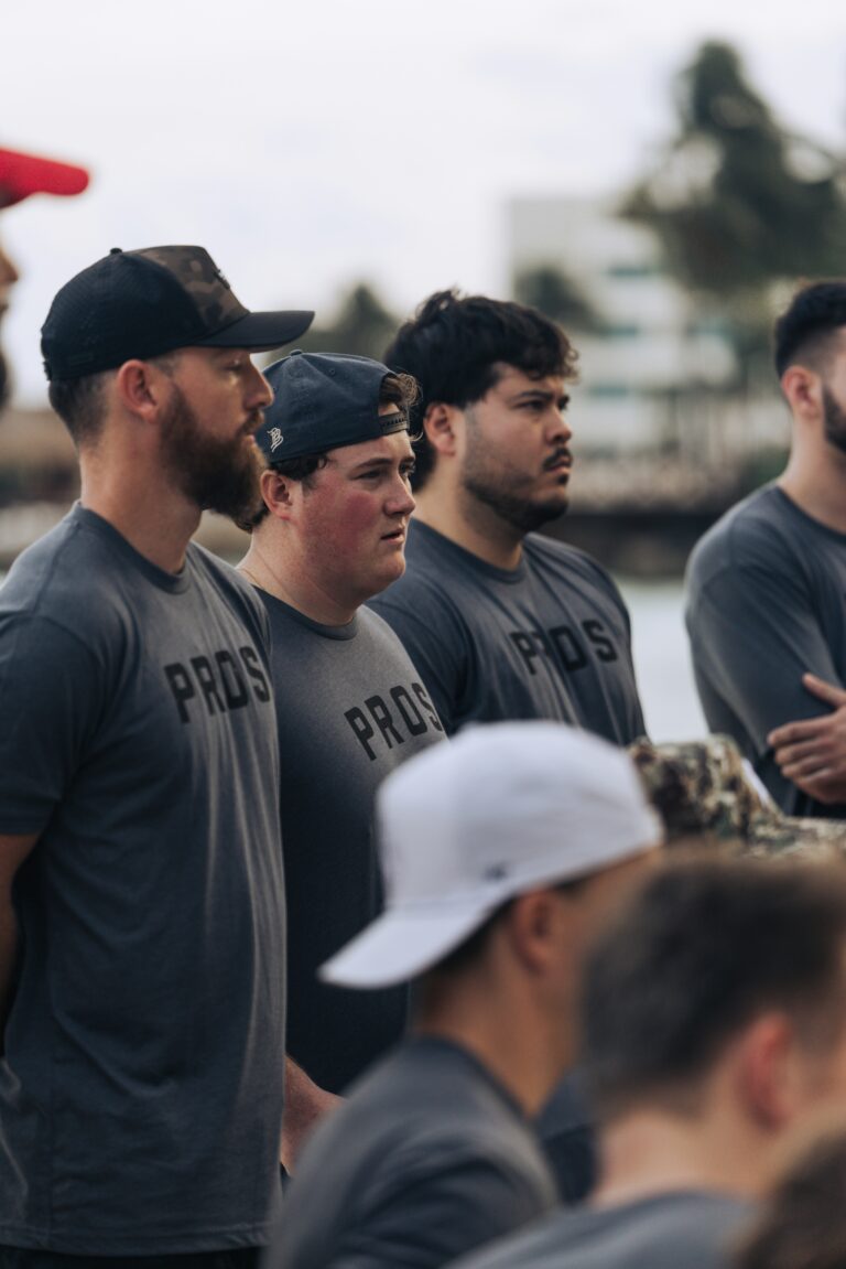 A group of men doing a training activity outdoors.