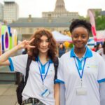 Two young women volunteering.