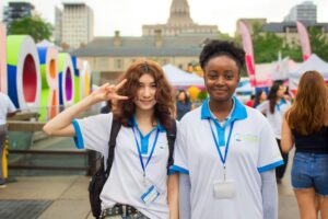 Two young women volunteering.