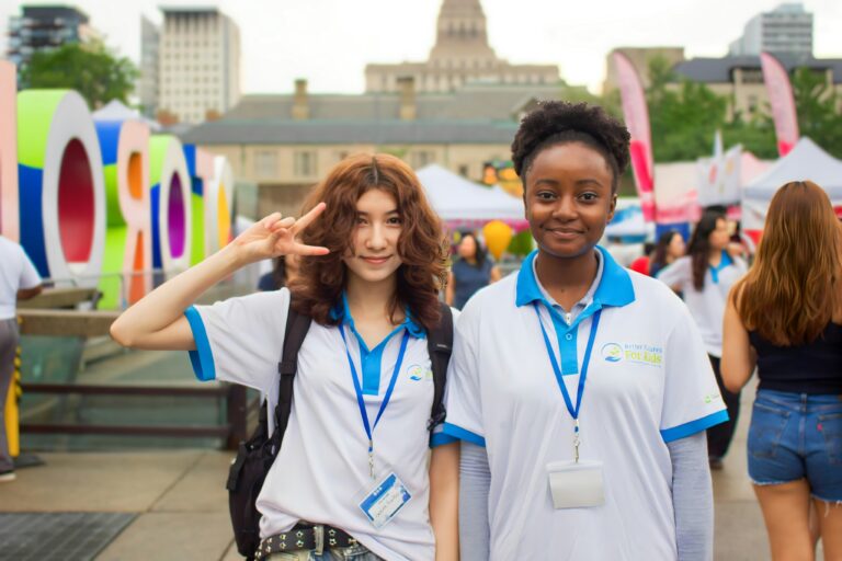 Two young women volunteering.